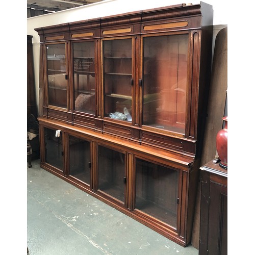 796 - A magnificent Victorian apothecary cabinet, c.1860, the top and base each with four glazed doors, wi... 