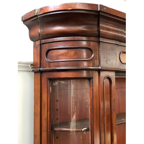 796 - A magnificent Victorian apothecary cabinet, c.1860, the top and base each with four glazed doors, wi... 