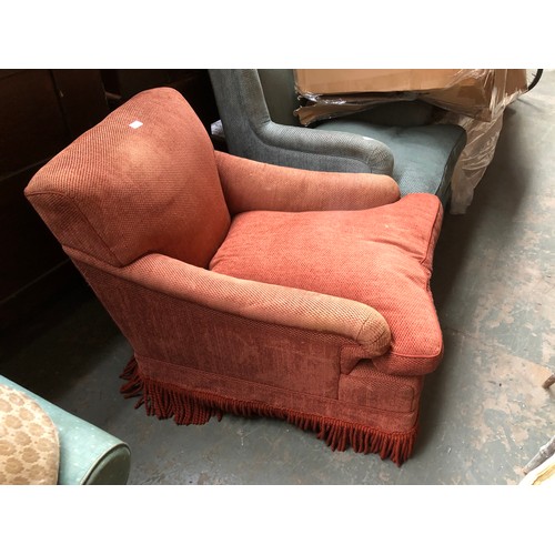 750 - A generous 20th century Howard style armchair upholstered in brick fabric, 76cm wide, 102cm deep