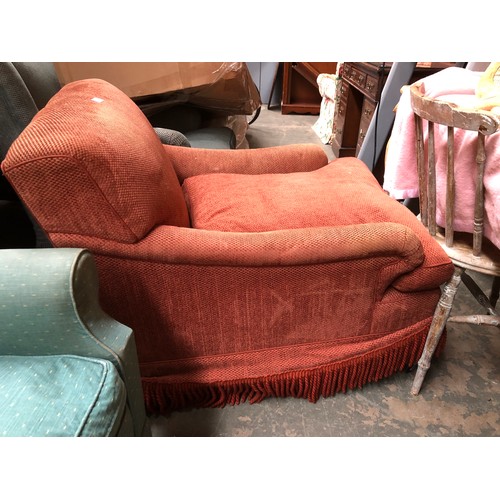 750 - A generous 20th century Howard style armchair upholstered in brick fabric, 76cm wide, 102cm deep