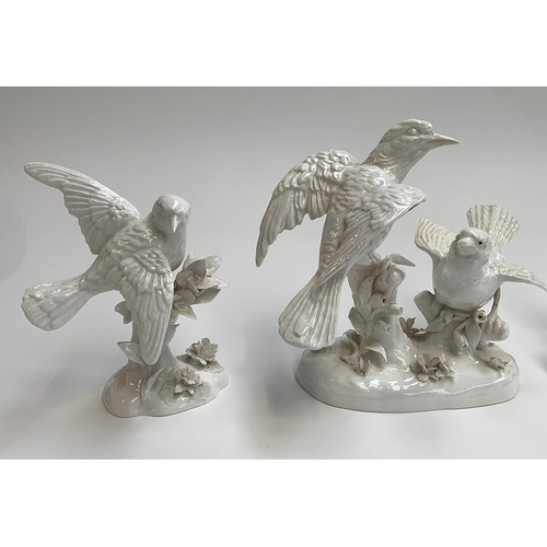 86 - A collection of four Crown Staffordshire white glaze bird figurines, modelled by G.T Jones, two af, ... 