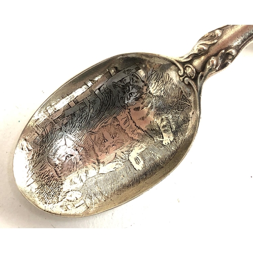 58 - A sterling silver chased caddy spoon, the terminal chased with a cat, bowl engraved with three cats,... 