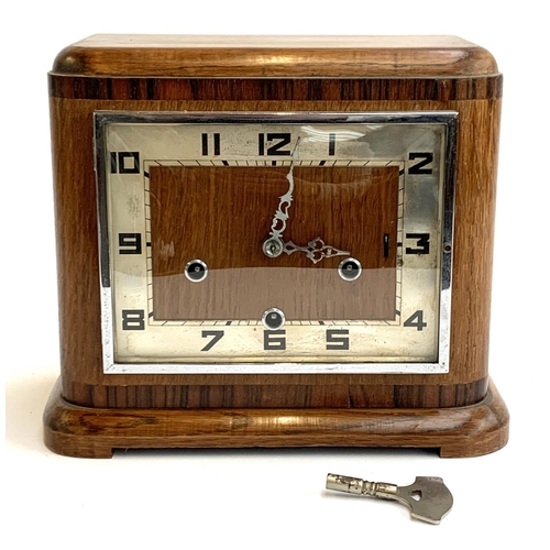 76 - A vintage Enfield oak cased mantel clock, with key, 27.5cmW