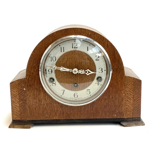 78 - An Enfield oak cased domed mantel clock, 30cmW