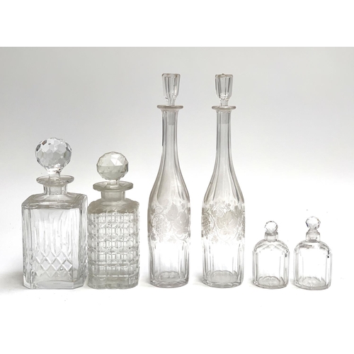 101 - A pair of 19th century grape and vine bottle form decanters, 35cmH; a moulded glass decanter made in... 