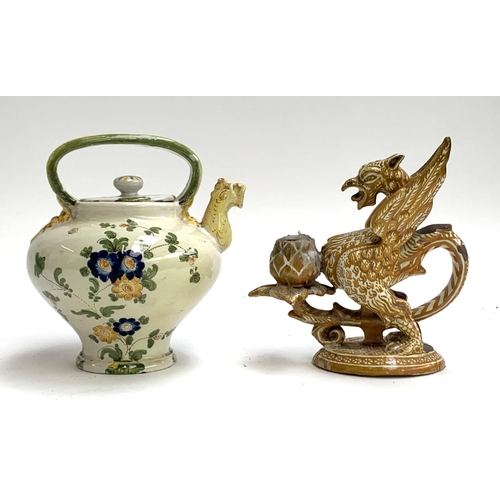 111 - An Italian Cantagalli majolica teapot, with serpent form spout, hand painted with a spray of flowers... 