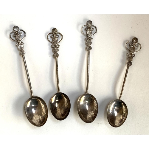 63 - Four white metal Arts and Crafts style teaspoons