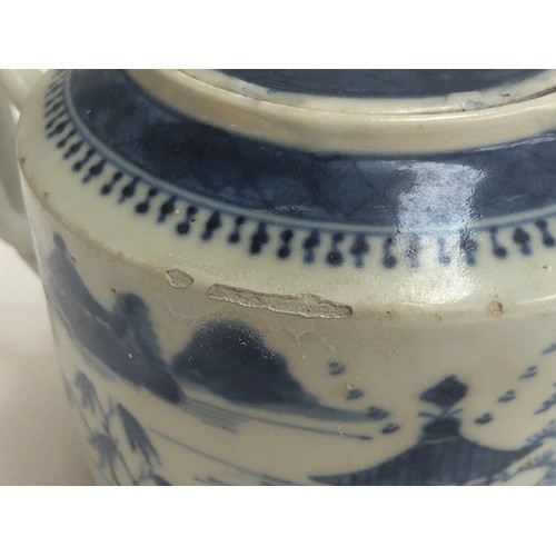 120 - A Chinese export blue and white teapot of cylindrical form with entwined bifurcated handle, repairs ... 