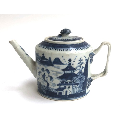 120 - A Chinese export blue and white teapot of cylindrical form with entwined bifurcated handle, repairs ... 