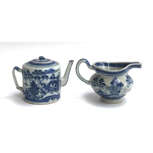 121 - A small Chinese export blue and white teapot, entwined bifurcated handle, 11.5cmH; together with a s... 