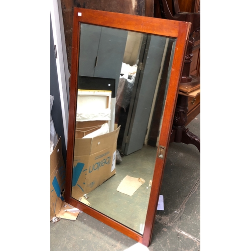 840 - A large bevelled mirror (cupboard door), 134x70cm