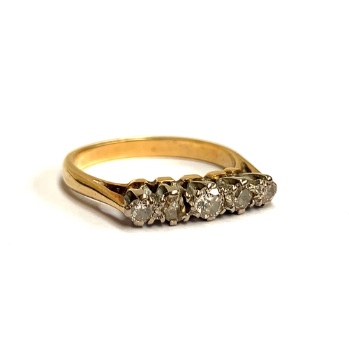 15 - A gold and diamond five stone ring, unmarked but tests as 18ct, one stone chipped, size L, 2.8g