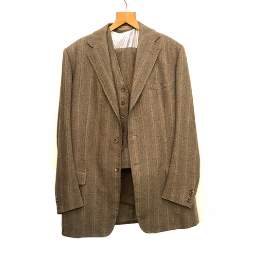 539 - A Denman & Goddard three piece brown tweed suit c.1975, the trousers with button fly and brace butto... 