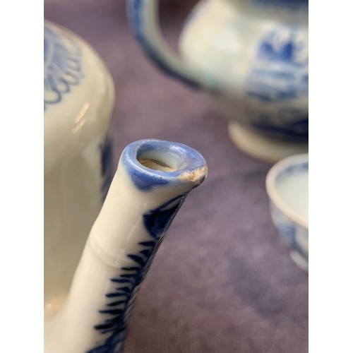 121 - A small Chinese export blue and white teapot, entwined bifurcated handle, 11.5cmH; together with a s... 