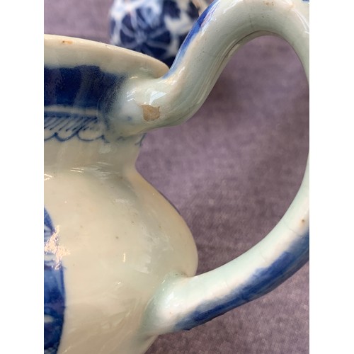 121 - A small Chinese export blue and white teapot, entwined bifurcated handle, 11.5cmH; together with a s... 