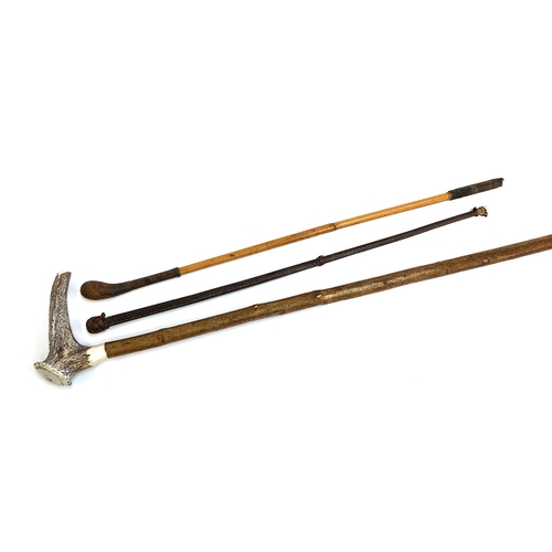 70 - A antler and hazel walking stick, 96cmL, together with two riding whips