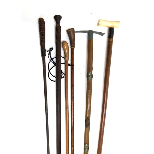 85 - An early 20th century bone handled walking cane with silver collar, together with an Alpine stick ma... 