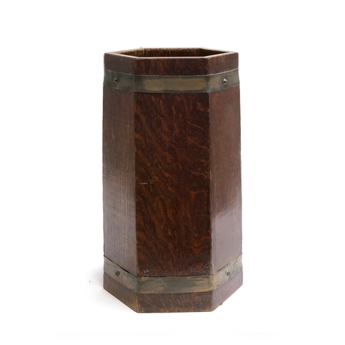 90 - An oak and brass banded hexagonal stick stand, with fitted drip tray, bears ivorine plaque for R. Al... 