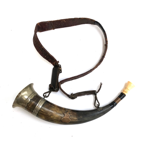 109 - A Continental hunting horn, with leather strap