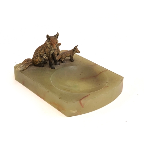 116 - An onyx pin dish with cold painted bronze vixen seated and two cubs