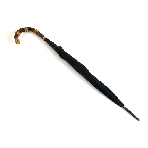 83 - A gent's black umbrella with bamboo handle, 93cm long