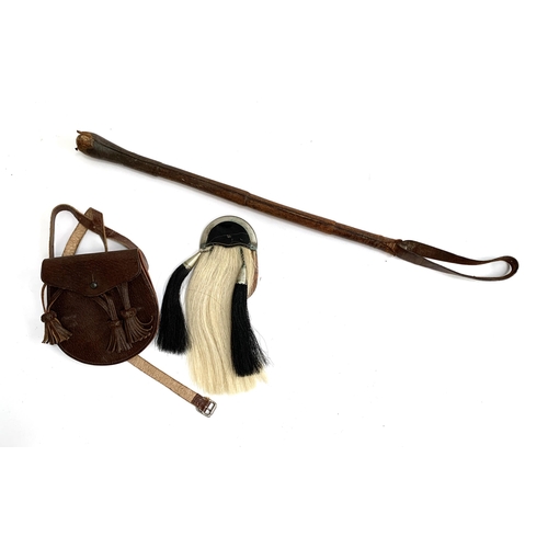 99 - A child's sporran together with a leather riding whip with lead knop, 47cmL