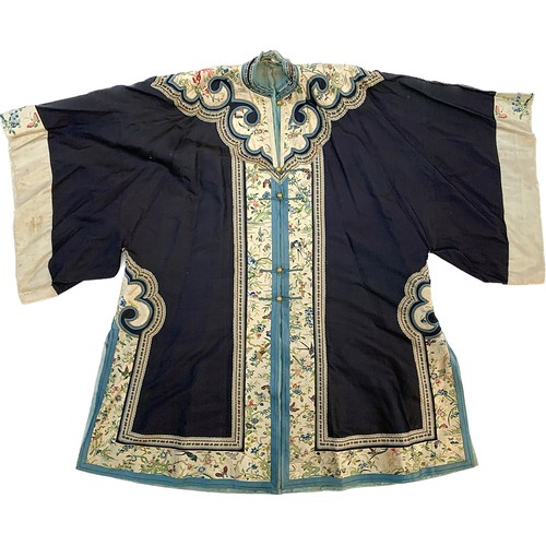 A 19th century Chinese silk Waitao women's overcoat, front opening with gilt metal robe buttons, the navy blue silk ground with a cream ruyi shaped collar and profuse satin stitch embroidered edges depicting birds, goldfish and insects amongst flora, the pale blue damask silk lining with multiple roundels depicting dragons chasing flaming pearls, 102cm long