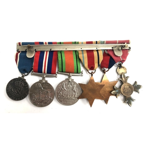 992 - A set of six medals comprising an Order of the British Empire OBE Medal, The 1939-1945 Star, The Afr... 