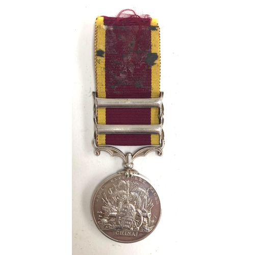 986 - A Second China War medal with Taku Forts 1860 and Canton 1857 clasps, unnamed