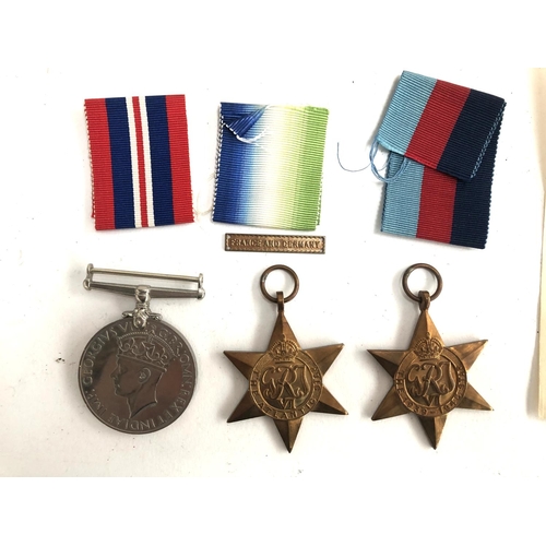 988 - A WWII Atlantic Star with a France and Germany clasp, together with a 1939-45 Star and a War Medal, ... 