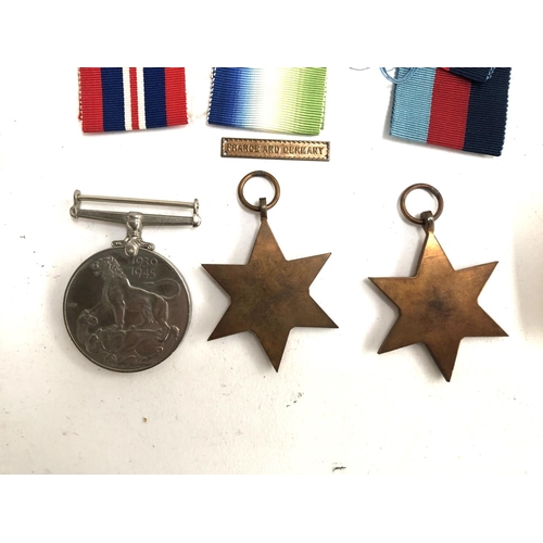 988 - A WWII Atlantic Star with a France and Germany clasp, together with a 1939-45 Star and a War Medal, ... 