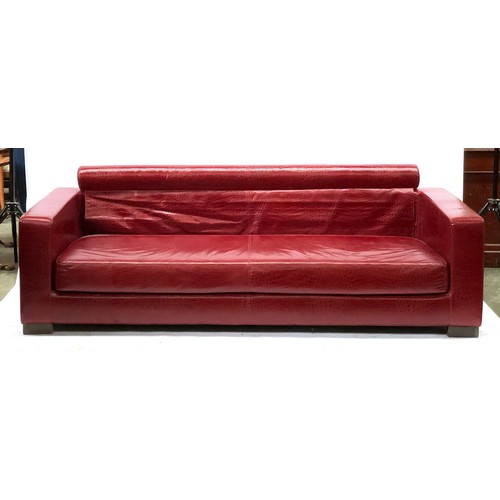 525 - A Fendi Casa three seater sofa, faux crocodile upholstered finish, with two Fendi cowhide cushions, ... 