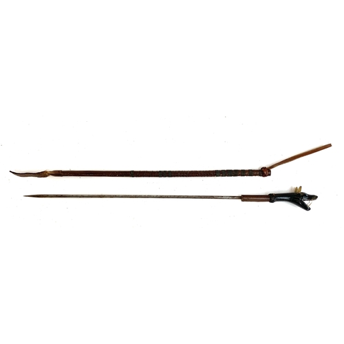 100 - An early 20th century leather horse whip with concealed steel hunting spike, the handle with carved ... 