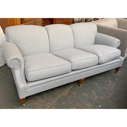 1640 - A good three seater sofa, upholstered in grey, square tapered legs on caps and casters, 214cmW