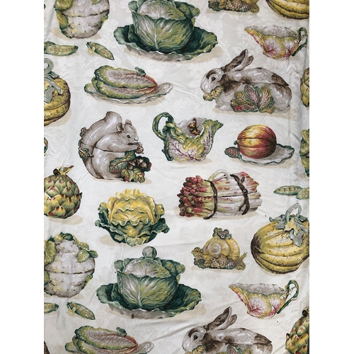 1644 - A pair of curtains, lined and interlined, in a colourful print depicting squirrels, cabbage ware, ra... 