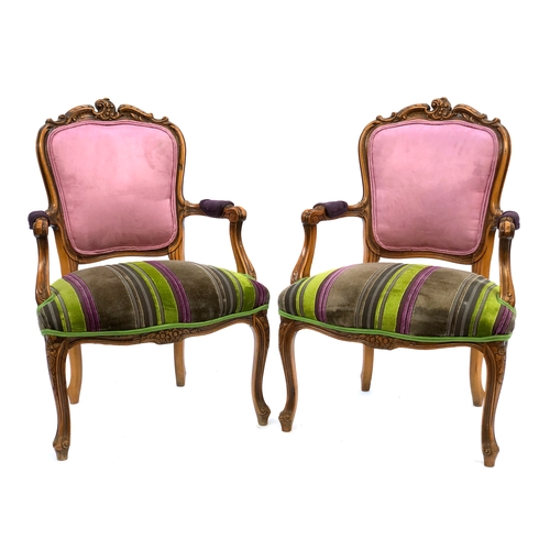 1647 - A pair of Louis XV style open armchairs, of recent manufacture, carved frames with striped bright co... 