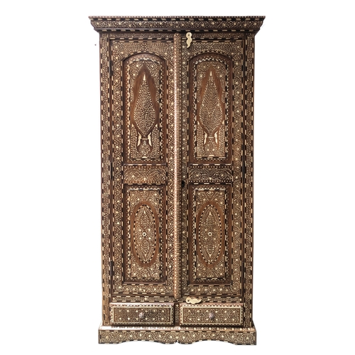 1663 - An Egyptian bone inlaid hardwood wardrobe, with two doors, 106cm wide, 50cm deep, 205cm high