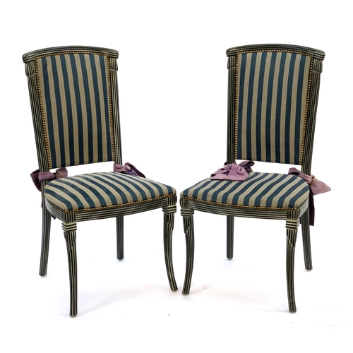 1664 - A pair of painted side chairs, upholstered in a striped blue fabric, tied with purple bows (2)