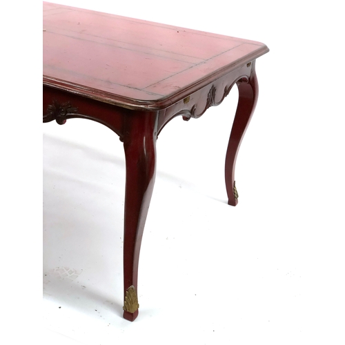 1665 - A red painted extendable dining table by Moissonnier, having a shaped carved apron on faceted cabrio... 