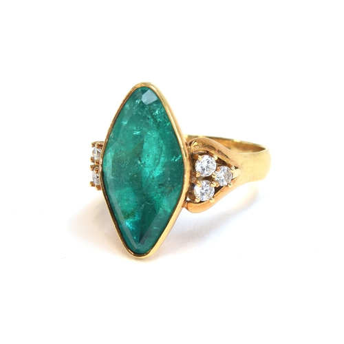 52 - An impressive 18ct yellow gold ring set with a large navette shaped emerald, estimated 9.35 carats, ... 