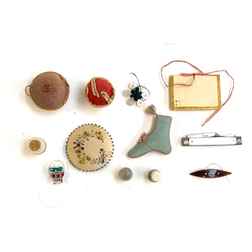 269 - Sewing interest: A collection of 19th century sewing tools to include a likely French porcelain thim... 