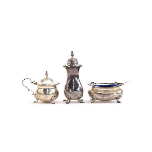 131 - A three piece silver cruet by Mappin & Webb, Birmingham 1925, comprising pepper, salt and mustard, w... 