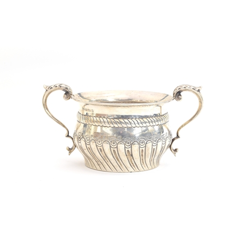 136 - A late Victorian twin handled bowl, Barnabas Blackburn, London 1897, with twin acanthus capped handl... 