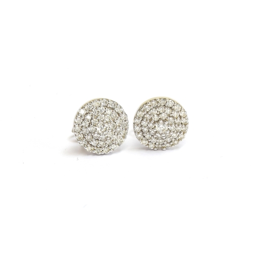 80 - A pair of 14ct white gold diamond cluster stud earrings, each 1.1cm diameter, gross weight 3.1g