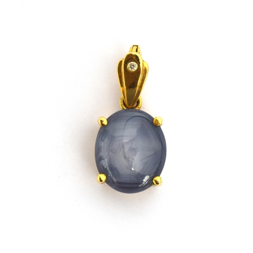 73 - An 18ct gold mounted star sapphire cabochon pendant, approx. 12cts, the bail set with a small diamon... 