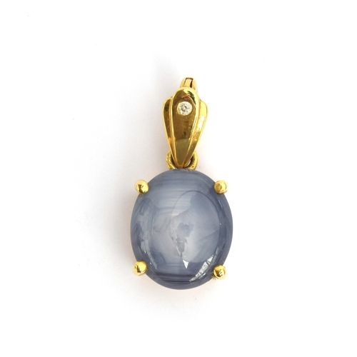 73 - An 18ct gold mounted star sapphire cabochon pendant, approx. 12cts, the bail set with a small diamon... 