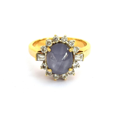 74 - An 18ct gold star sapphire and diamond cluster ring, the sapphire approx. 5cts, size Q, 8.7g