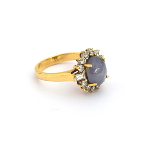 74 - An 18ct gold star sapphire and diamond cluster ring, the sapphire approx. 5cts, size Q, 8.7g