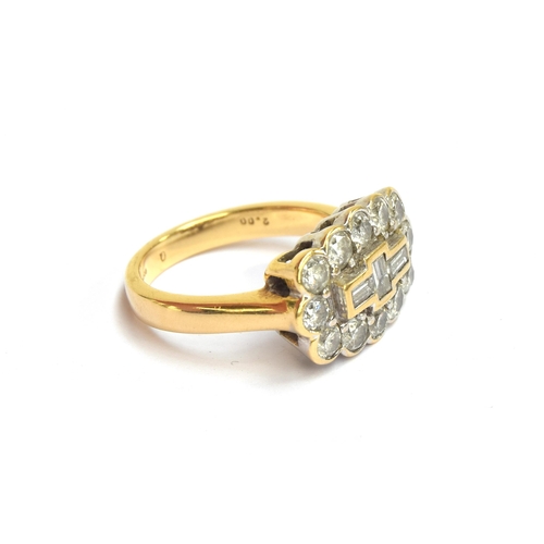 75 - An 18ct gold and diamond cluster ring, the twelve brilliant cut diamonds surrounding a central panel... 