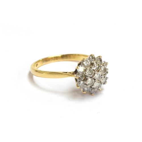 77 - An 18ct gold diamond cluster ring, the diamonds totalling approx. 1ct, size P 1/2, 4.3g